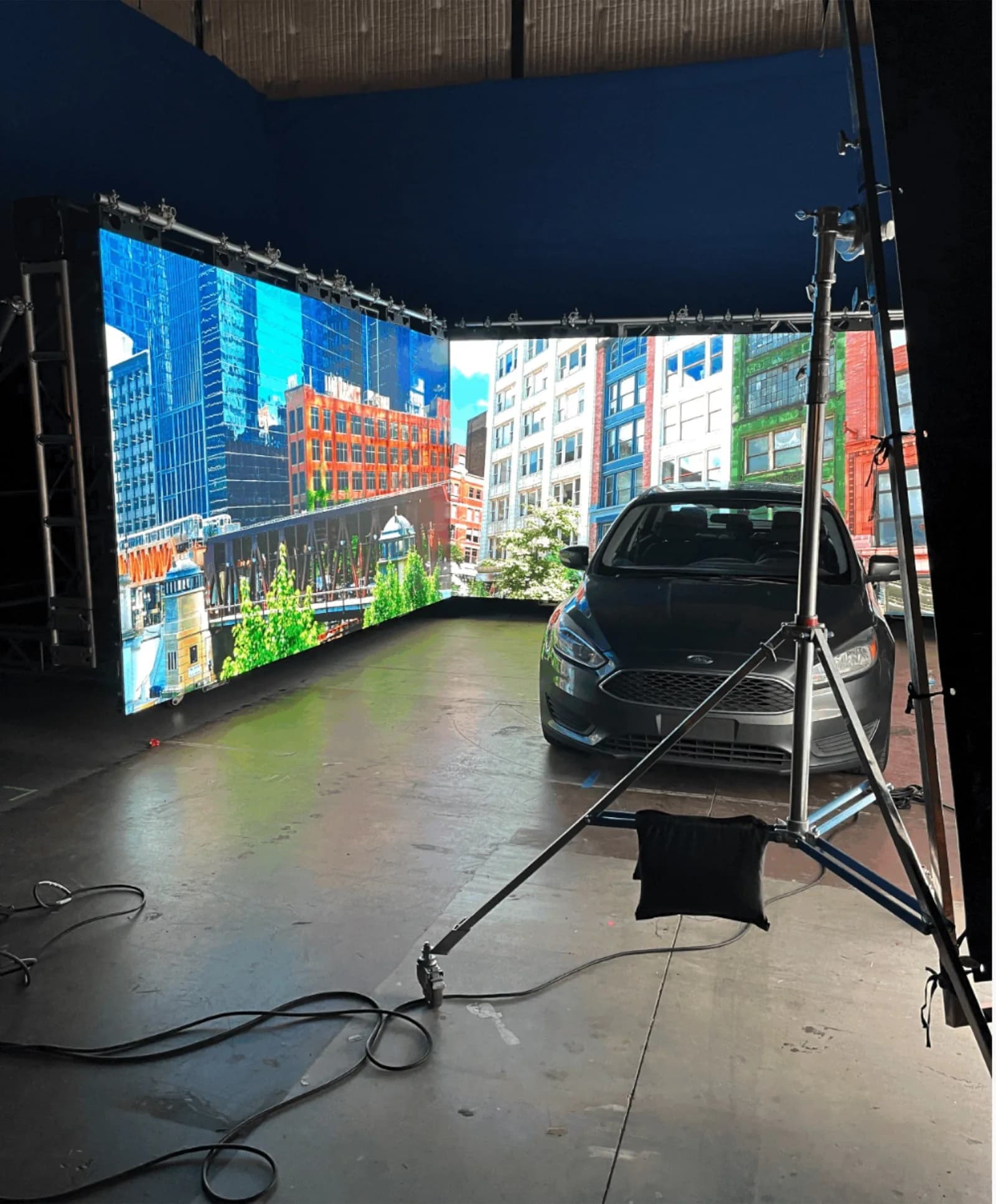 Swirl LED volume walls at ATL Film Studios with an in-camera driving plate and a car on the stage. A film and live-events client.